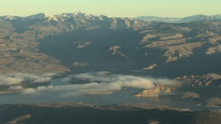 HDA13_415 - HD stock footage aerial video of the Blue Mesa Reservoir and the Rocky Mountains at sunrise, Colorado