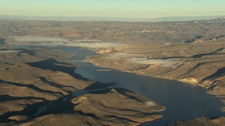 HDA13_419 - HD stock footage aerial video of the Blue Mesa Reservoir and Rocky Mountains at sunrise, Colorado