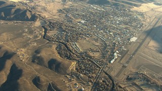 HDA13_426 - HD stock footage aerial video approach the small town of Gunnison at sunrise, Colorado