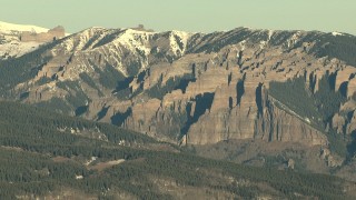 HDA13_430 - HD stock footage aerial video of steep and jagged slopes with snow at sunrise, Rocky Mountains, Colorado