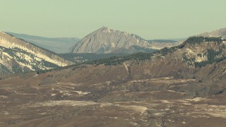 HDA13_437 - HD stock footage aerial video of stony peaks in the Rocky Mountains at sunrise, Colorado