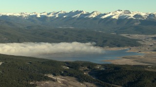 HDA13_441 - HD stock footage aerial video of fog on the Taylor Park Reservoir at sunrise near the Rocky Mountains, Colorado
