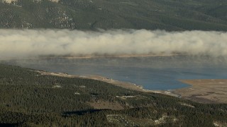 HDA13_443 - HD stock footage aerial video of fog over the Taylor Park Reservoir at sunrise, Colorado