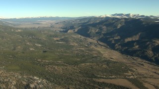 HDA13_452 - HD stock footage aerial video of rural homes at sunrise at the base of mountains, Buena Vista, Colorado