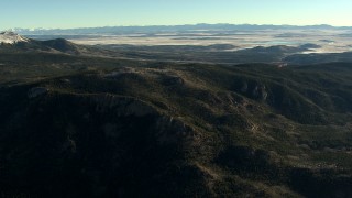 HDA13_454 - HD stock footage aerial video of flying over rounded slopes at sunrise in the Rocky Mountains, Colorado