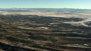 HDA13_457 - HD stock footage aerial video of flying over hills with light snow in Park County, Colorado
