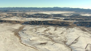 HDA13_465 - HD stock footage aerial video of approaching hills with light snow in Park County, Colorado
