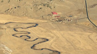 HDA13_472 - HD stock footage aerial video of a farm and a winding river in Park County, Colorado