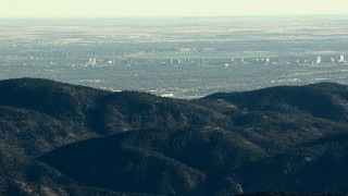 HDA13_479 - HD stock footage aerial video of Centennial office buildings visible from a ridge in the Rocky Mountains, Colorado