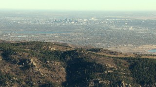 HDA13_482_03 - HD stock footage aerial video zoom wider from Downtown Denver and Marston Lake, reveal the Rocky Mountains, Colorado