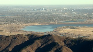 HDA13_482_05 - HD stock footage aerial video of the Downtown Denver skyline and reservoir seen from the Rocky Mountains, Colorado