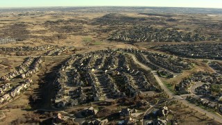 HDA13_486_01 - HD stock footage aerial video of flying over tract homes and mansions in Castle Pines, Colorado