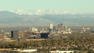 HDA13_488_02 - HD stock footage aerial video of Centennial office buildings, Downtown Denver skyscrapers and Rocky Mountains, Colorado