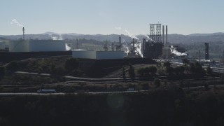 JDC01_023 - 5K aerial stock footage of ConocoPhillips Oil Refinery, light traffic passing by, Rodeo, California