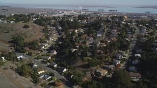 JDC01_033 - 5K aerial stock footage fly over suburban tract homes, reveal Valero Oil Refinery, Benicia, California
