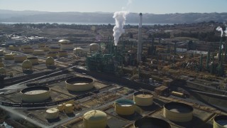 JDC01_037 - 5K aerial stock footage of flying by Valero Oil Refinery buildings, Benicia, California