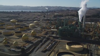 JDC01_038 - 5K aerial stock footage of flying by Valero Oil Refinery buildings, Benicia, California