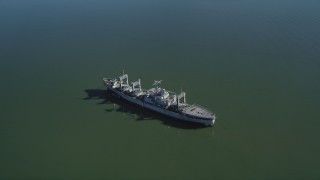JDC01_040 - 5K aerial stock footage of flying by a National Defense Reserve Fleet warship, Suisun Bay, California