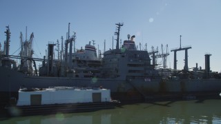 JDC01_043 - 5K aerial stock footage of flying by National Defense Reserve Fleet warships, Suisun Bay, California