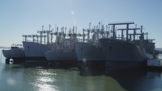 JDC01_044 - 5K aerial stock footage of flying by National Defense Reserve Fleet warships, Suisun Bay, California