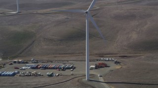 JDC01_070 - 5K aerial stock footage of cargo containers and Shiloh Wind Power Plant windmill, Montezuma Hills, California