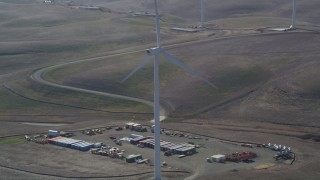 JDC01_071 - 5K aerial stock footage of shipping containers and Shiloh Wind Power Plant windmill, Montezuma Hills, California