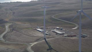 JDC01_072 - 5K aerial stock footage of cargo containers by Shiloh Wind Power Plant windmills, Montezuma Hills, California