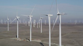 JDC01_076 - 5K aerial stock footage of flying by a row of windmills, Shiloh Wind Power Plant, Montezuma Hills, California