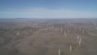 JDC01_080 - 5K aerial stock footage of hilly field of windmills, Shiloh Wind Power Plant, Montezuma Hills, California