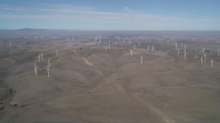 JDC01_081 - 5K aerial stock footage of a hilly field with windmills, Shiloh Wind Power Plant, Montezuma Hills, California