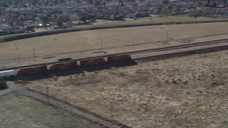 JDC01_085 - 5K aerial stock footage track train past fields and residential neighborhoods, Pittsburg, California