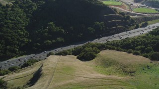 JDC02_005 - 5K aerial stock footage of flying by Highway 24 freeway through hills, Orinda, California