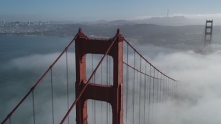 JDC02_017 - 5K stock footage aerial video orbit the Golden Gate Bridge and fog, reveal Alcatraz and Downtown San Francisco, California