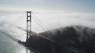 JDC02_018 - 5K stock footage aerial video of an orbit of thick fog rolling over Golden Gate Bridge, San Francisco, California