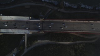 JDC02_024 - 5K stock footage aerial video of a bird's eye view over traffic, fog on Golden Gate Bridge, San Francisco, California