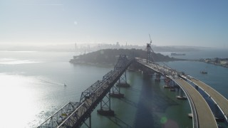JDC02_046 - 5K aerial stock footage of passing by the Bay Bridge, new span under construction, San Francisco, California