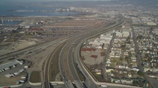 JDC02_047 - 5K stock footage aerial video of flying by I-880 freeway by urban neighborhoods, Oakland, California