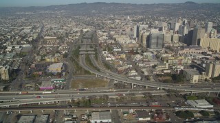 JDC02_048 - 5K stock footage aerial video of flying by 880 freeway and urban neighborhoods, revealing I- 980, Downtown Oakland, California