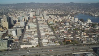 JDC02_050 - 5K stock footage aerial video of flying by the city's office buildings and Lake Merritt, Downtown Oakland, California