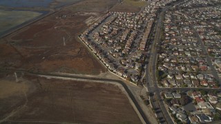 JDC03_003 - 5K aerial stock footage of flying away from tract homes and marshland, Union City, California