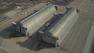 JDC03_021 - 5K stock footage aerial video tilt to reveal Hangar Two, Hangar Three at Moffett Field military base, Mountain View, California