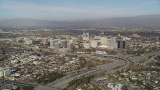 JDC04_006 - 5K stock footage aerial video of flying by freeway interchange with a view of Downtown San Jose, California
