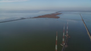 JDC04_036 - 5K aerial stock footage of flying by wetlands, tilt down revealing radio towers, Fremont, California