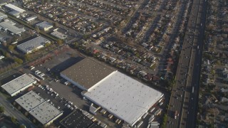 JDC04_041 - 5K stock footage aerial video fly away from suburban neighborhoods, warehouses by I-880 freeway, San Leandro, California