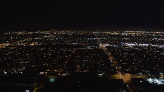 LD01_0001 - 5K aerial stock footage of lifting off from Hawthorne Municipal Airport, California at night