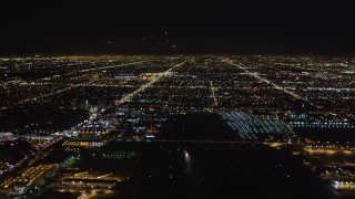 LD01_0008 - 5K stock footage aerial video tilt from runway to reveal approaching jet at night, LAX (Los Angeles International Airport), California