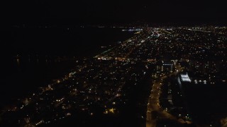 LD01_0022 - 5K aerial stock footage pan across and fly over Venice, California at night