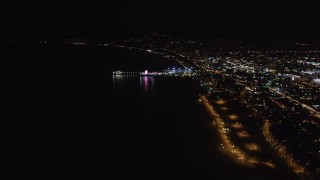 LD01_0024 - 5K aerial stock footage video an approach to the Santa Monica Pier, California at night
