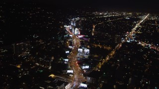 LD01_0062 - 5K aerial stock footage following the Sunset Strip at night in West Hollywood, California
