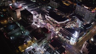 LD01_0072 - 5K aerial stock footage of mall, theaters and hotels at night in Hollywood, California
